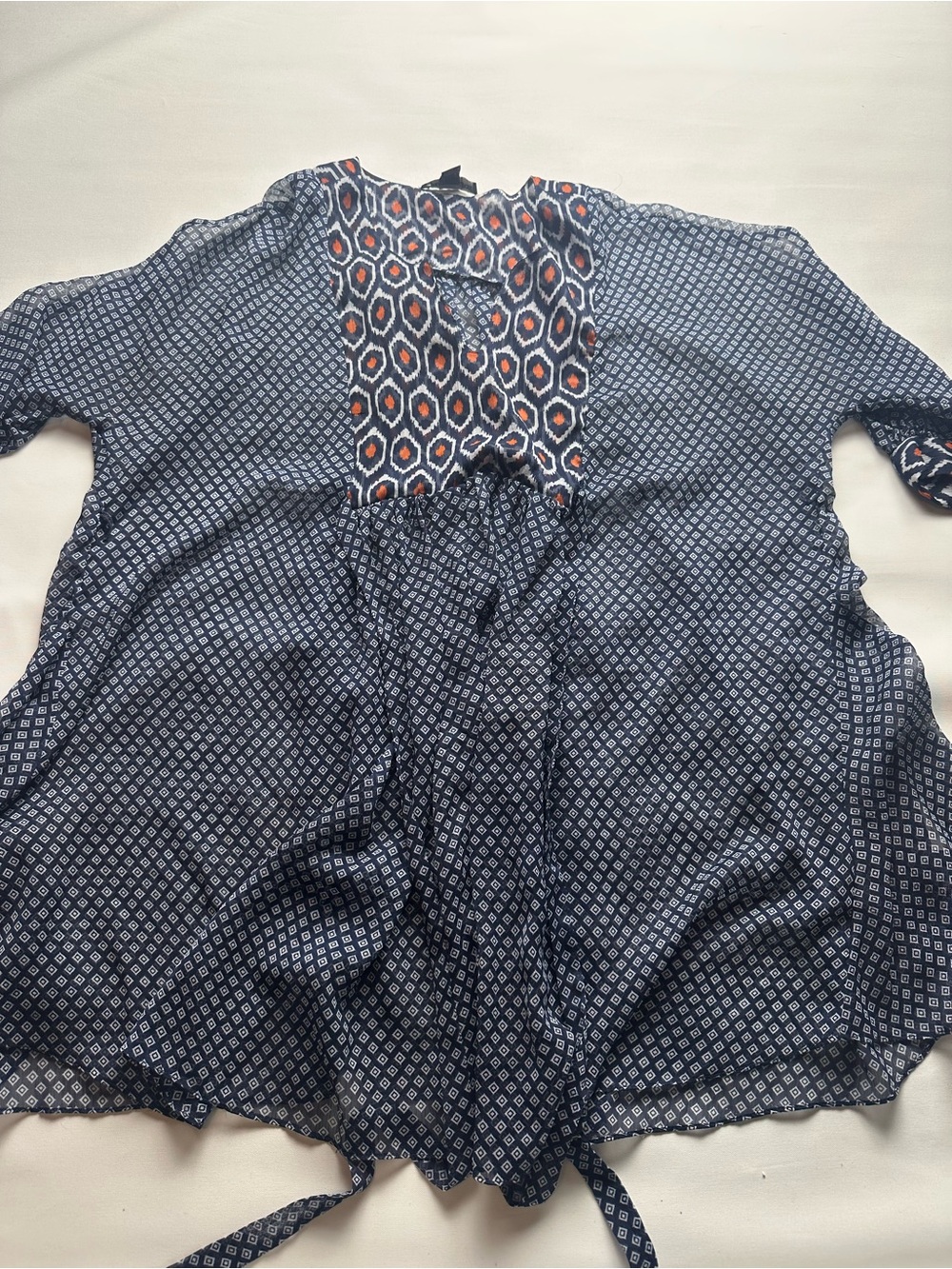 A Pea in the Pod Navy Geometric Tie front Tunic with Orange Accents. Size L